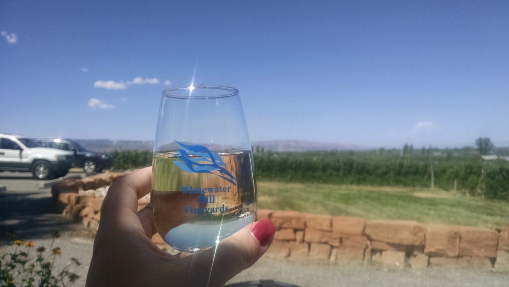 Enjoying a glass of wine at Whitewater Hill Vineyards in Grand Junction, Colorado.