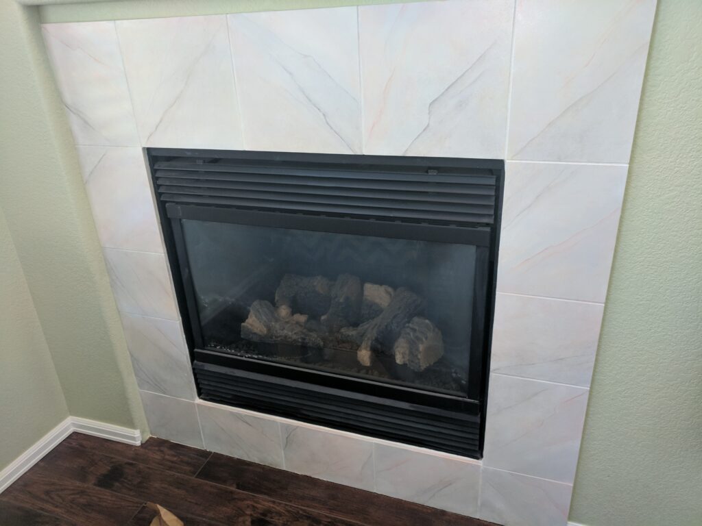 Faux marble fireplace (decorative painting finish) in a private residence in Longmont, CO.