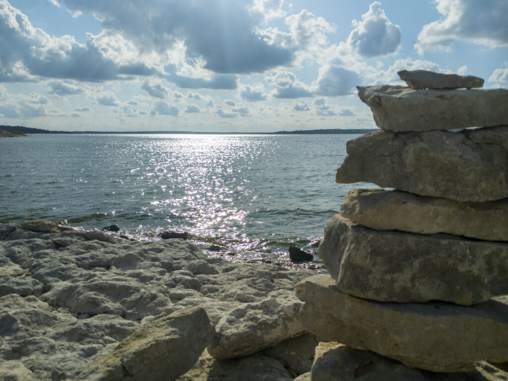 Stacked limestone rocks on the shore of Benbrook Lake in Crowley, TX.