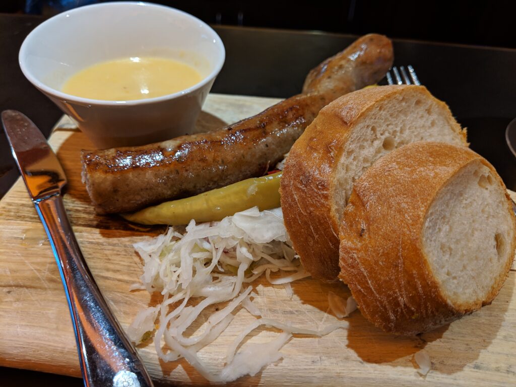Sausage, slaw, beer cheese and bread platter in Vienna, Austria.
