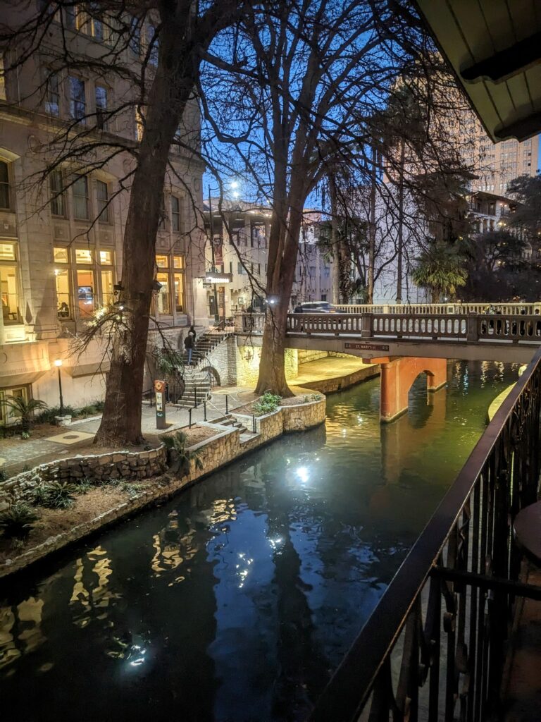 Nighttime view of the San Antonio Riverwalk.